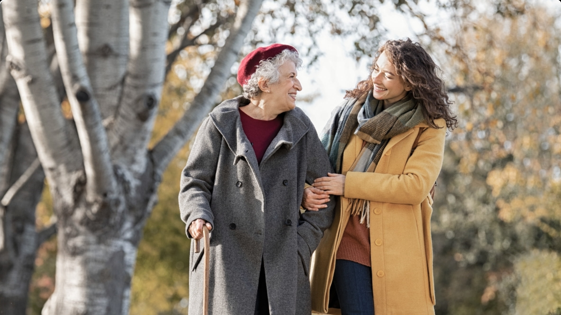 Grandson walking with his grandmother in the forest